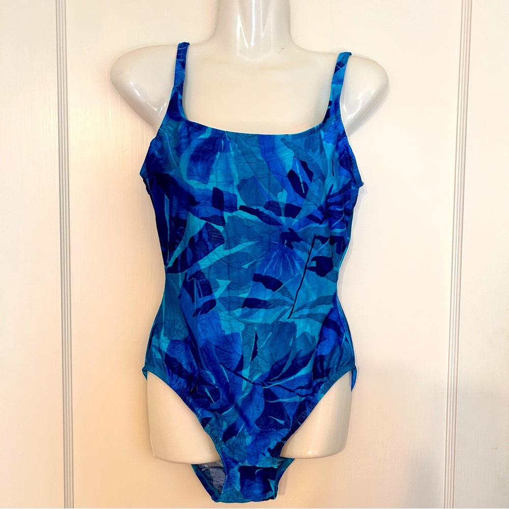 Brand new! Flattering Kathy Ireland one piece swimsuit. Lucious blue color.